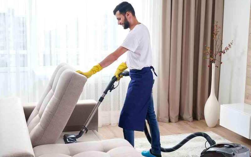 man-home-cleaning-service-vacuuming